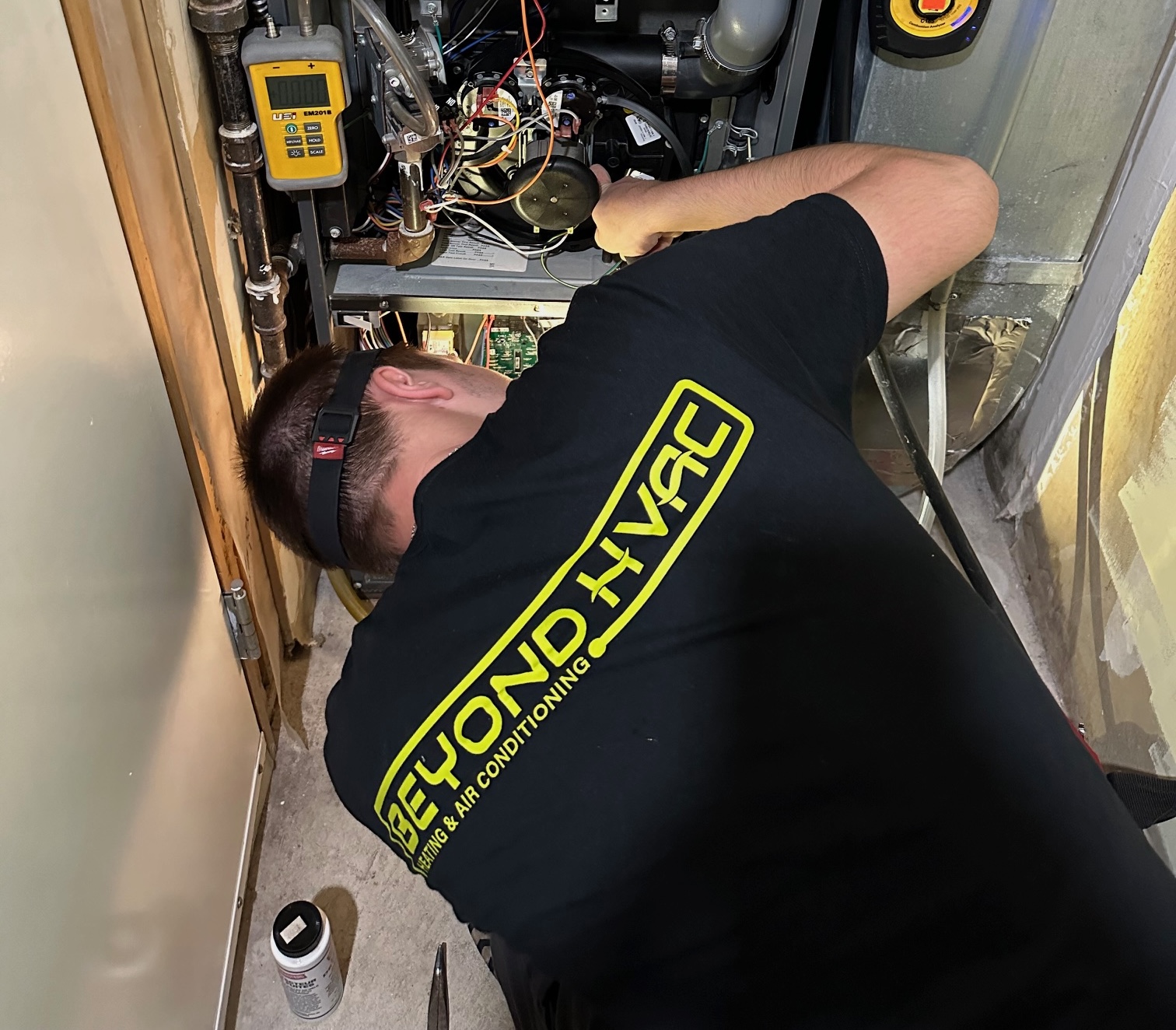 Beyond HVAC technician servicing a furnace in Etobicoke